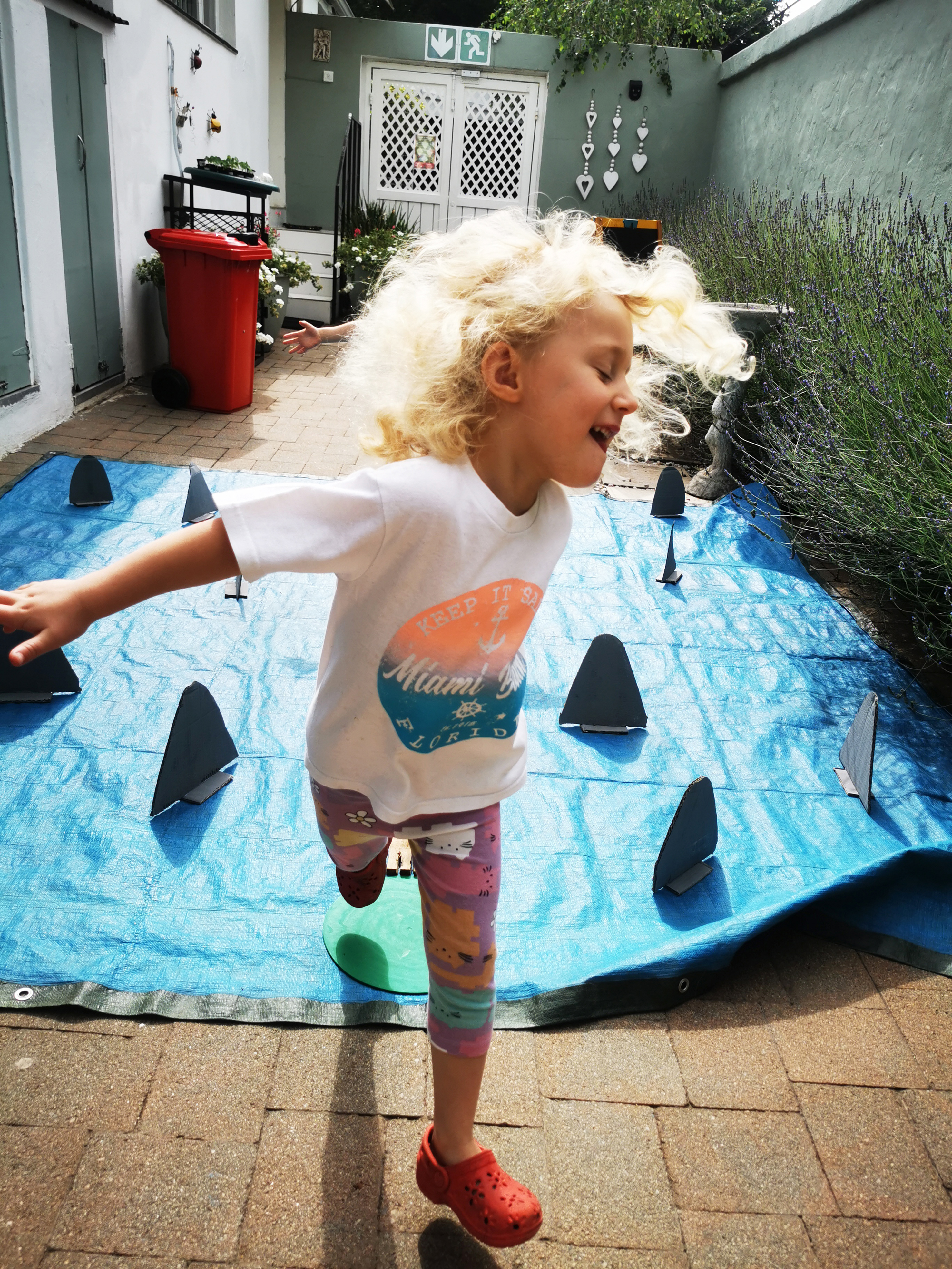 Happy girl playing walk the plank